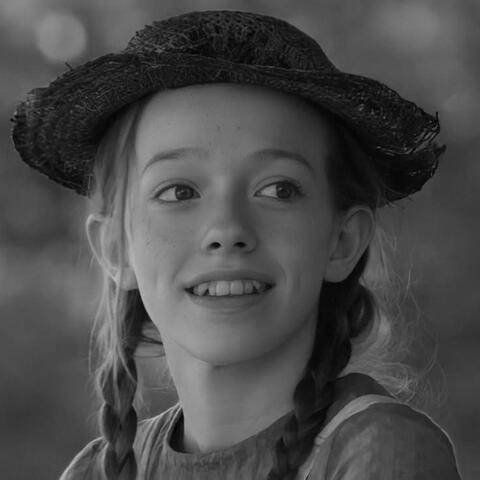 a black and white photo of anne shirley-cuthbert from anne with an e looking right.