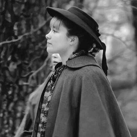 a black and white photo of amy march from little women (2019) looking left.